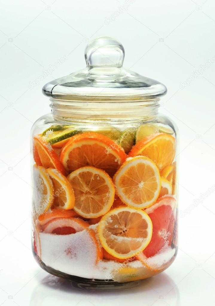 Sliced citrus fruits in a jar.
