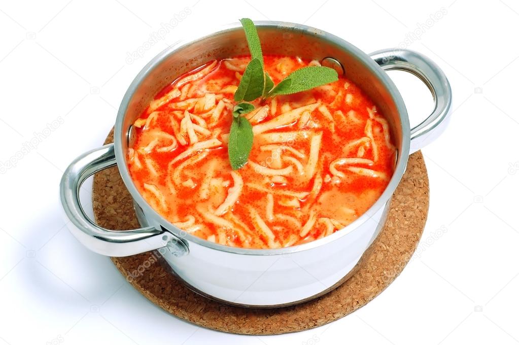 Traditional tomato soup with noodle in the pot