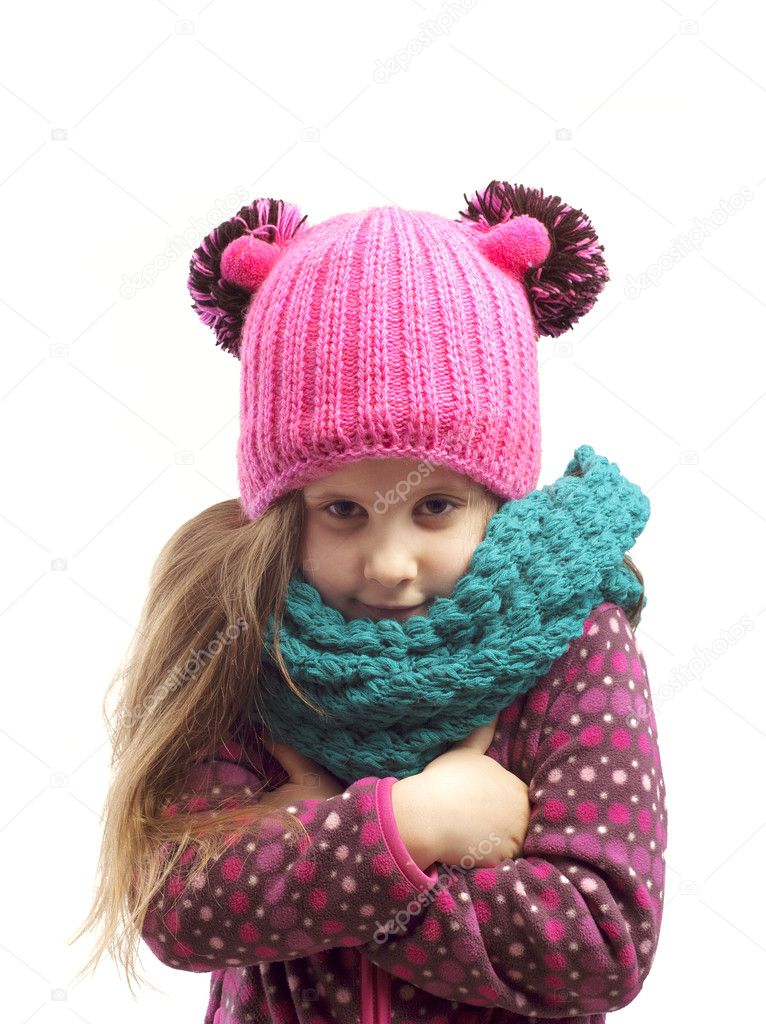 Portrait of a girl in a cap and scarf .