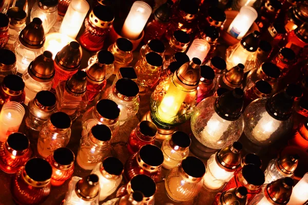 Candles burning at a cemetery during All Saints Day. — Stock Photo, Image