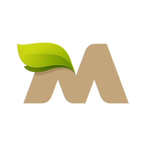 緑の葉と M の文字ロゴ. — ストックベクタ