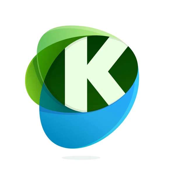 K letter with green leaves and blue drops. — Stock Vector