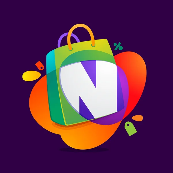 N letter with shopping bag icon and Sale tag. — Stock Vector