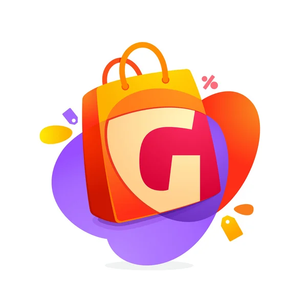 Carta G con icono de bolsa de compras y etiqueta de venta . — Vector de stock