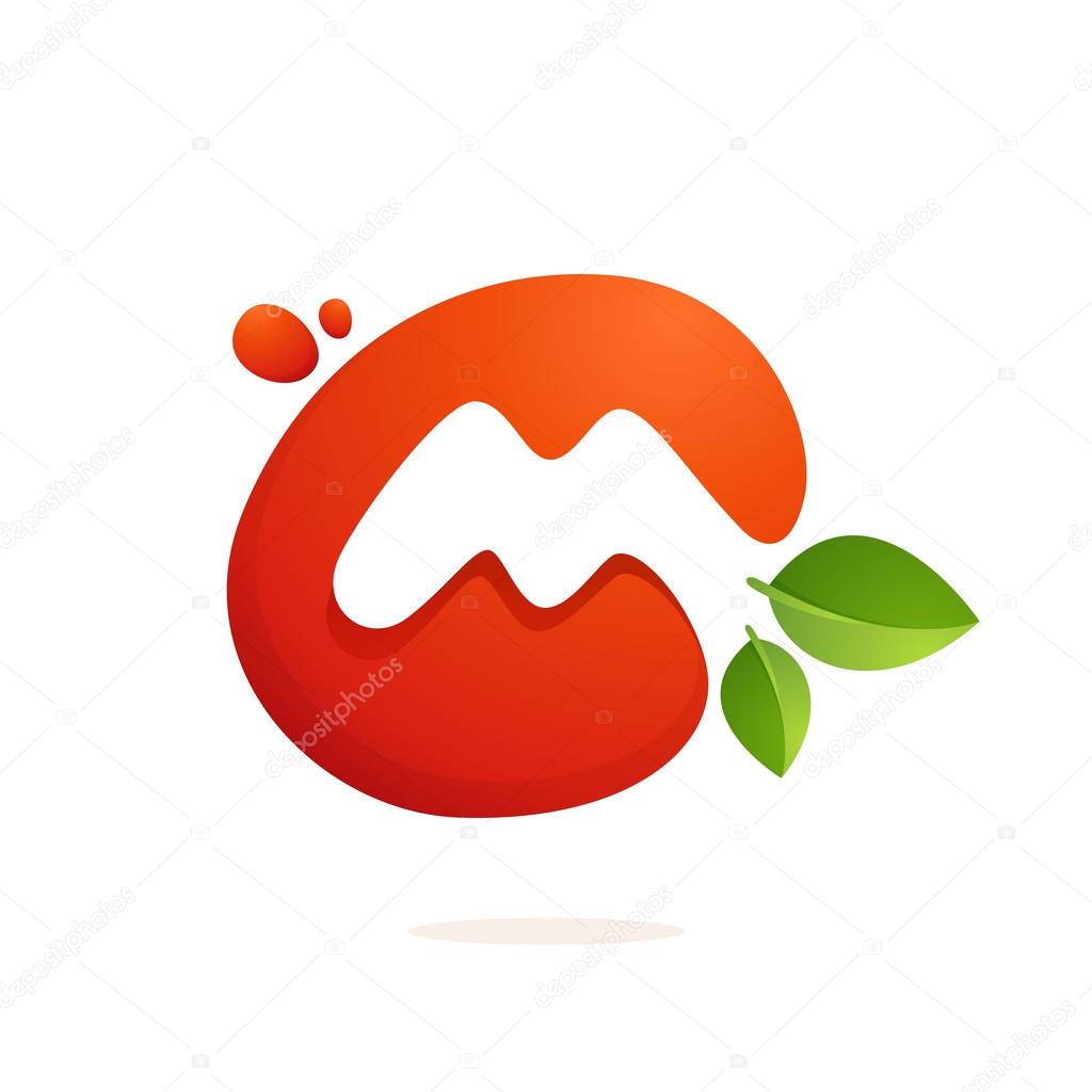 Letter M logo in fresh juice splash with green leaves. 