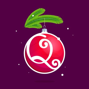 Q Noel kırmızı top ve çam dalları ile harfi.