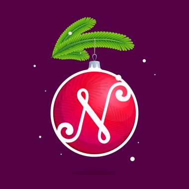 N harfi ile Noel kırmızı top ve çam dalları.