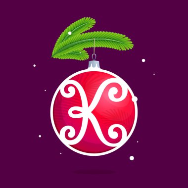 K harfi ile Noel kırmızı top ve çam dalları.