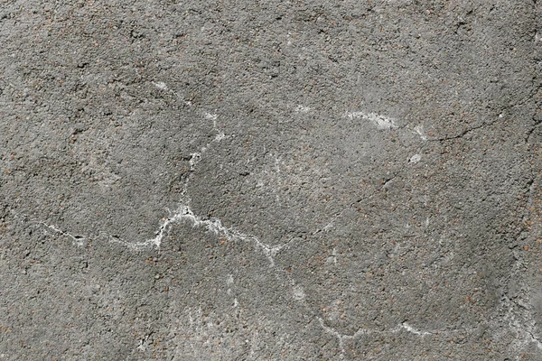 Eski gri beton duvarın arka planı.