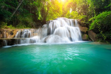Landscape photo, Huay Mae Kamin Waterfall, beautiful waterfall in rainforest at Kanchanaburi province, Thailand clipart