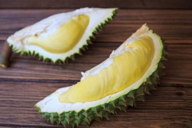 Durian Fruit on wood table clipart