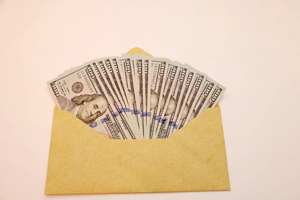 Envelope full of hundred dollar bills with new — Stock Photo, Image