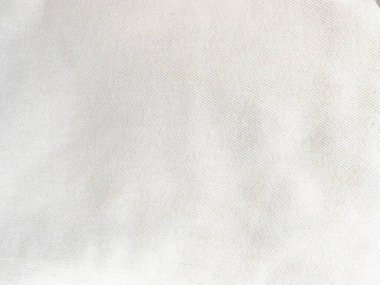 Eski beyaz kumaşın dokusu klasik bir donukluğa sahiptir, arka plan için klasik duvar kağıtları ve tasarımlar için kullanılan bir metin alanı vardır..