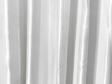 Perde dokusunun yüzeyinde gri-beyaz bir ton var. Duvar kağıdı veya arkaplan resmi için bunu kullanın. Metin için boş bir boşluk var.