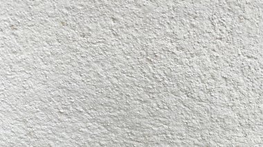 Beyaz beton duvarın pürüzsüz dokusu kaba bir yüzey, metin için boşluk, arkaplan için alan. 