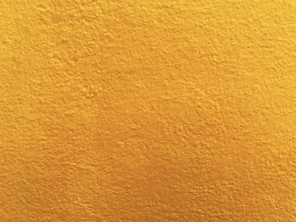 Seamless texture of yellow cement wall a rough surface, with space for text, for a background.