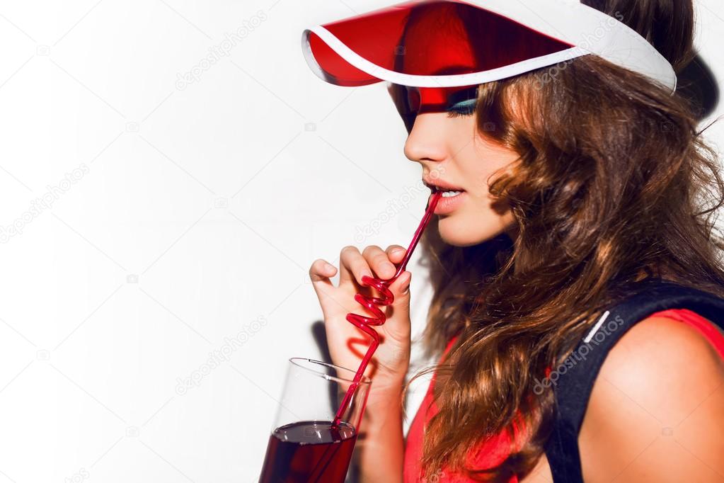 Sexy woman drinking cocktail.