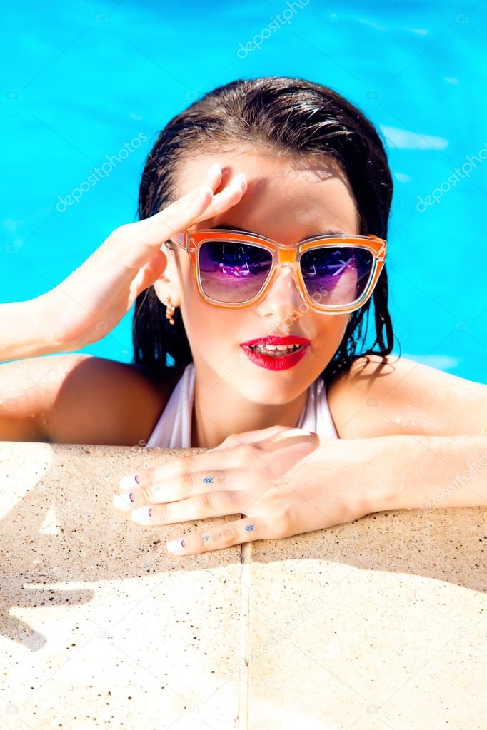 Sexy woman in bikini and sunglasses