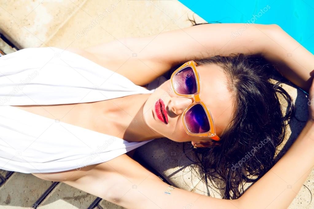 Sexy woman in bikini and sunglasses