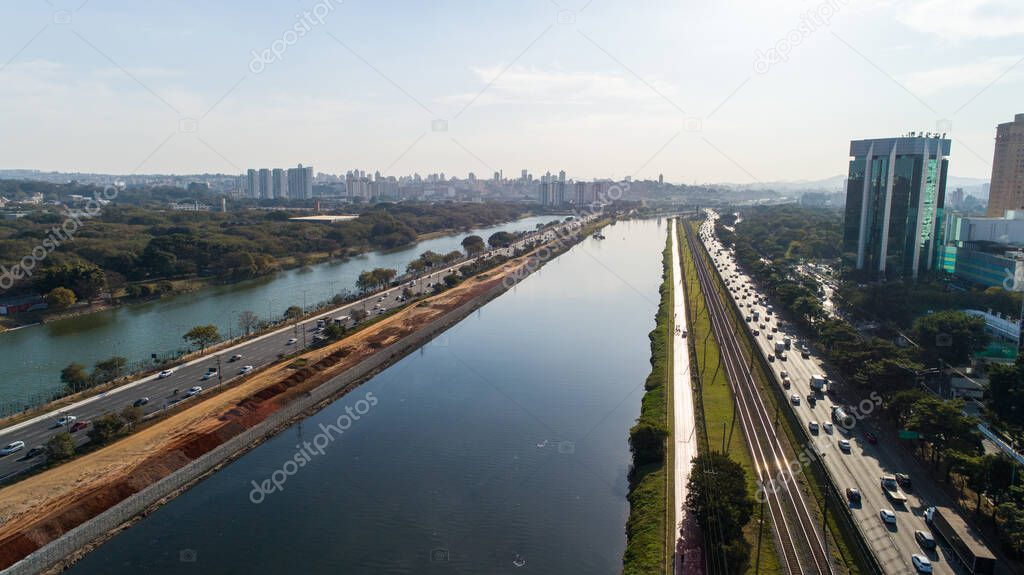 View of Marginal Pinheiros with the Pinheiros river and modern buildings in Sao Paulo, Brazil.
