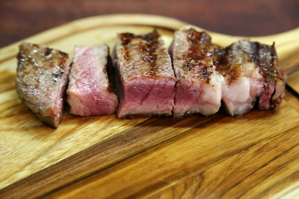 Chorizo. Brazilian barbecue. Steak cut on a wooden board.
