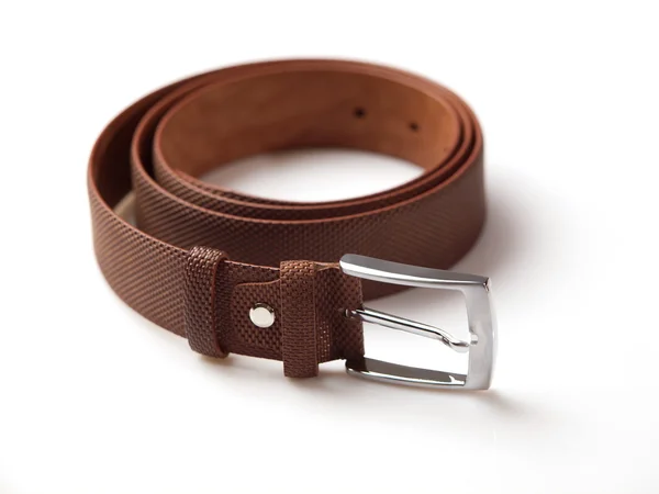 Textured brown men's belt with chrome clasp on white background — Stock Photo, Image