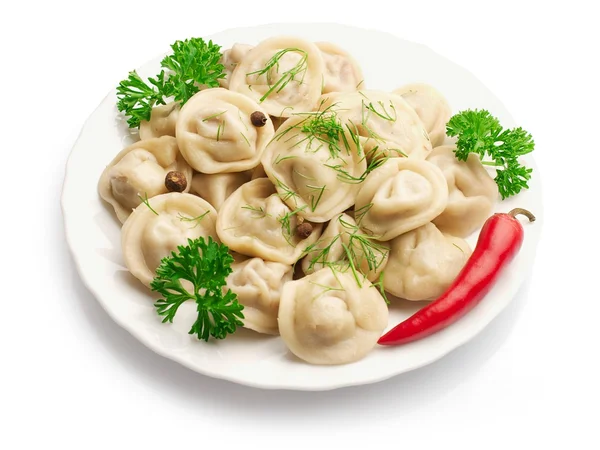 Boiled Ravioli on the plate with parsley, and red Bulgarian pepper over white background — Stock Image Boiled Ravioli on the plate with parsley, and red Bulgarian pepper over white background Stock Picture