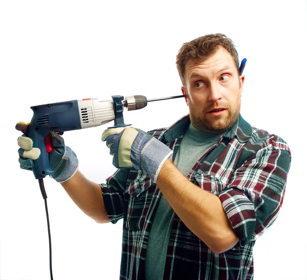 Rolig Workman i handskar med borr tråkigt hans öra på vit bakgrund — Stockfoto