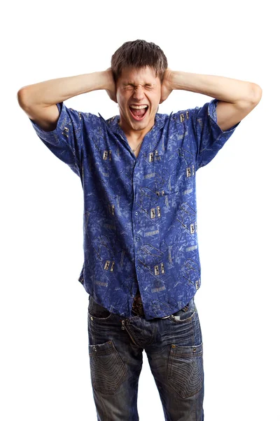 Screaming guy in the blue shirt close his ears because of too noise over white background — Stock Photo, Image