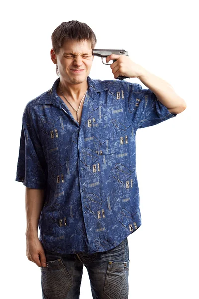 Stressed guy in the blue shirt and going to kill himself with a gun over white background — Stock Photo, Image