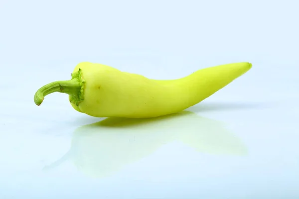 Light green chili on white background