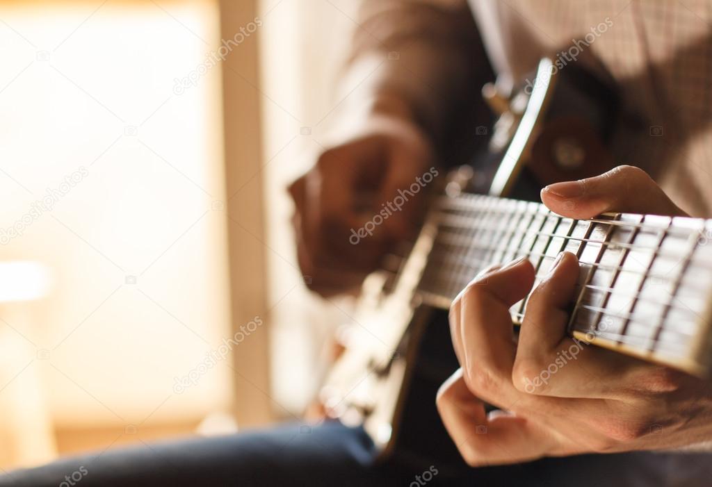 Practicing in playing guitar.