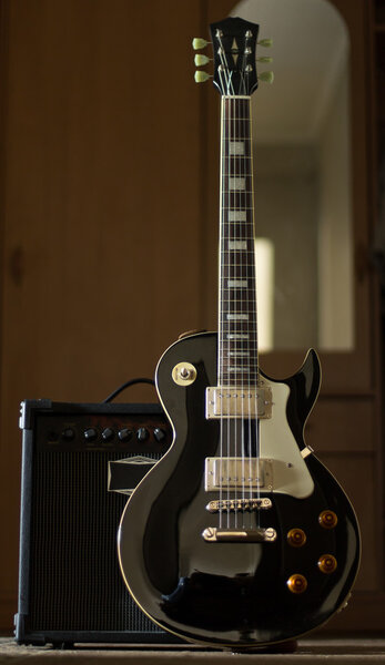 Electric guitar with amplifier together blues.