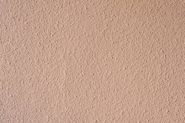 Beton duvardaki soyut arkaplan dokusu. Duvarın yüzeyi benekli boyayla kaplıydı. Dekoratif iç duvar kaplaması