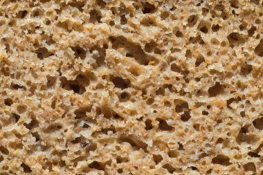 Arka plan olarak taze pişmiş çavdar ekmeği. Ekmek kesiti.