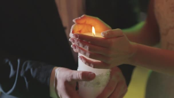 Married Couple Holding Burning Candle — Stock Video