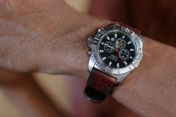 Caterpillar brand watches were exposed to being worn by a man in the afternoon.