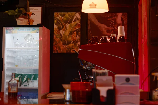 Attribute sightings of a coffee shop at night.