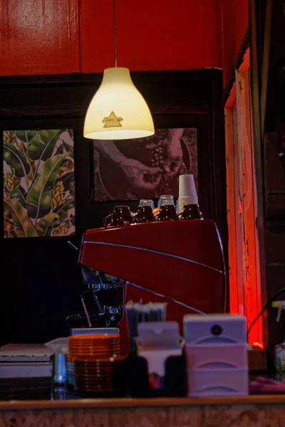 Attribute sightings of a coffee shop at night.