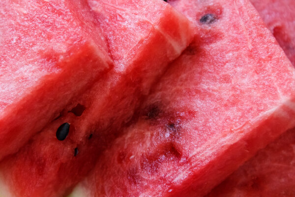 Juicy big red watermelon lying on a wooden table