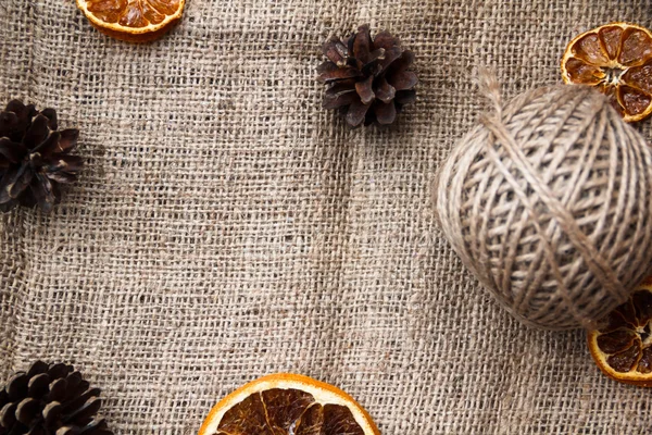 Bir kart, kumaş, portakal ve Noel için arka plan.