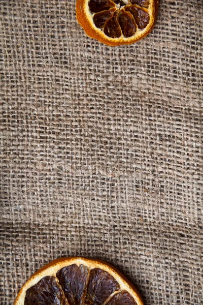 Bir kart, kumaş, portakal ve Noel için arka plan.