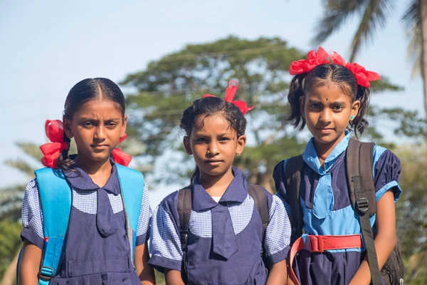 An Indian Rural School Girls wearing School Uniform Standing in outdoor