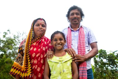 3 indian Rural farmer Parents and daughter standing clipart