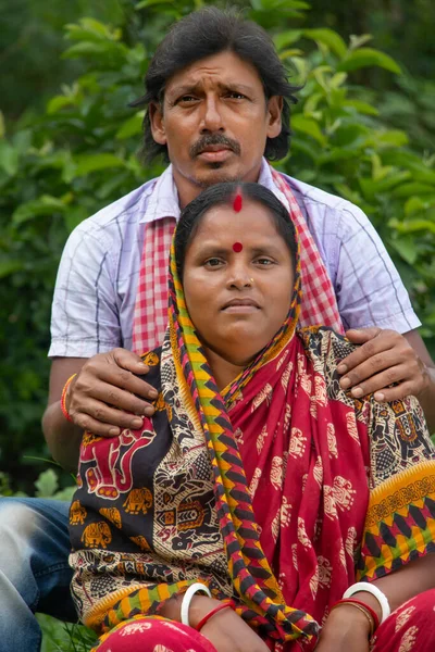 Indian Rural couple sitting in agricultural field