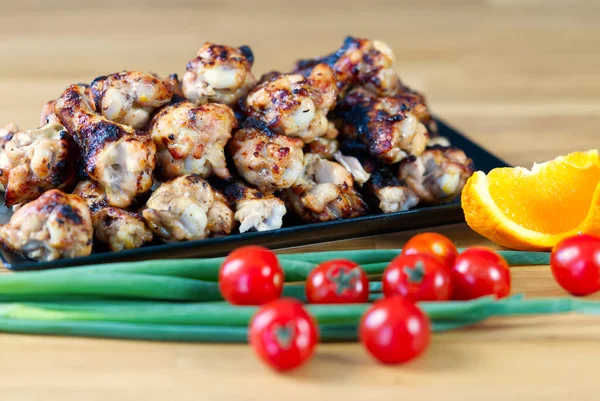 Meat fillet and vegetables. grilled chicken meat served with fresh vegetables on wooden table — Stock Photo, Image
