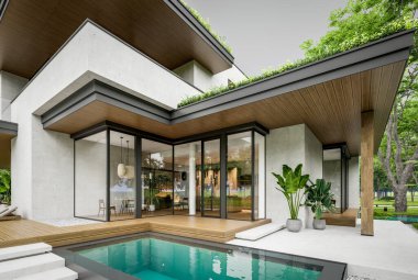 Park yeri ve havuzu satılık olan üç katlı bir ev. Ya da beton dış görünüş ve güzel peyzaj ile kiralanmış. Bulutlu beyaz gökyüzü bulutlu, yumuşak gölgeler