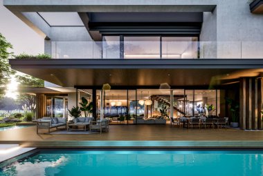 Park yeri ve havuzu satılık olan üç katlı bir ev. Ya da beton dış görünüş ve güzel peyzaj ile kiralanmış. Pencerenin sıcacık ışıklarıyla berrak bir yaz akşamı