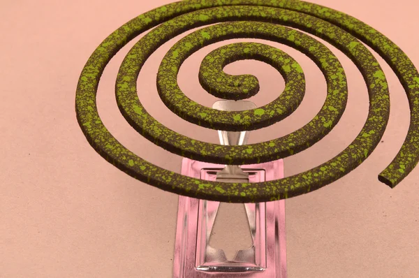 Burning mosquito coil, Mosquito coil is mosquito-repelling incense, usually shaped into a spiral, Anti mosquito made by neem leaves green color - insecticides — Stock Photo, Image