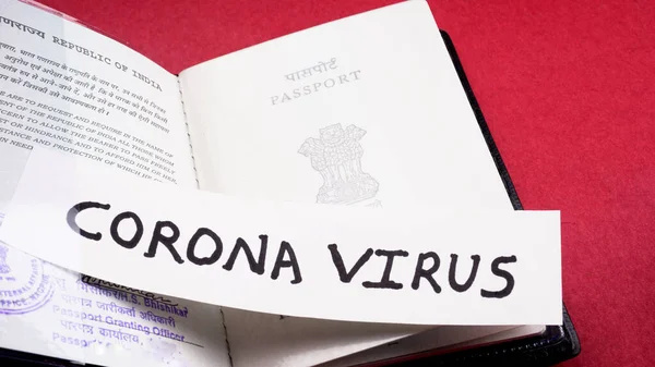 Coronavirus and travel concept. Note COVID-19, coronavirus, and passport.Travel restrictions and quarantine of tourists infected with Corona virus